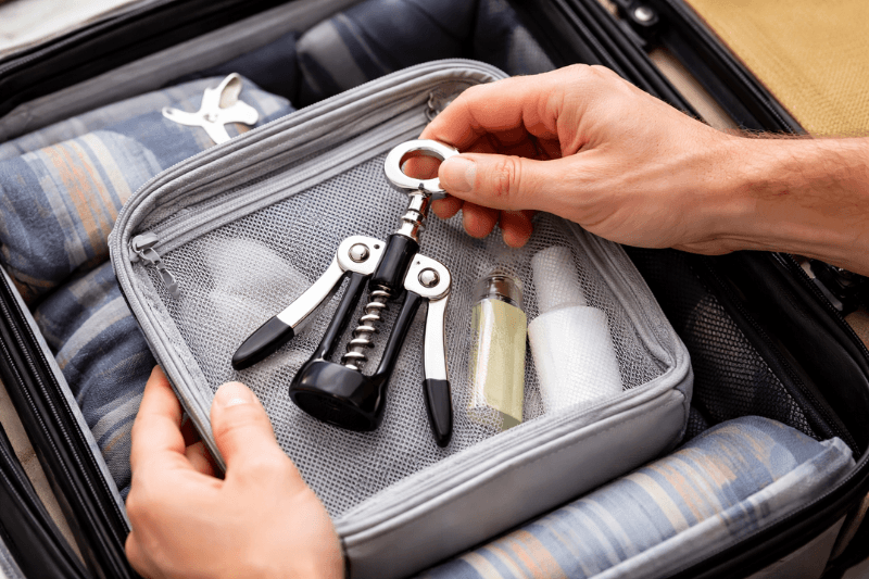 Packing a winged corkscrew in luggage, showing how to travel with a wine opener