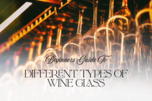 Hanging wine glasses under warm bar lighting, creating a soft bokeh background